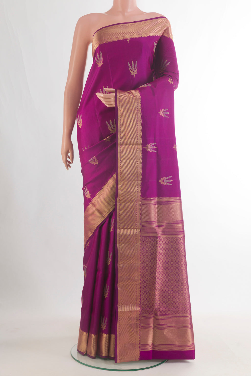 Pure Silk Magenta Soft Saree with Zari Butta on the body and Zari Border.  displayed on a mannequin