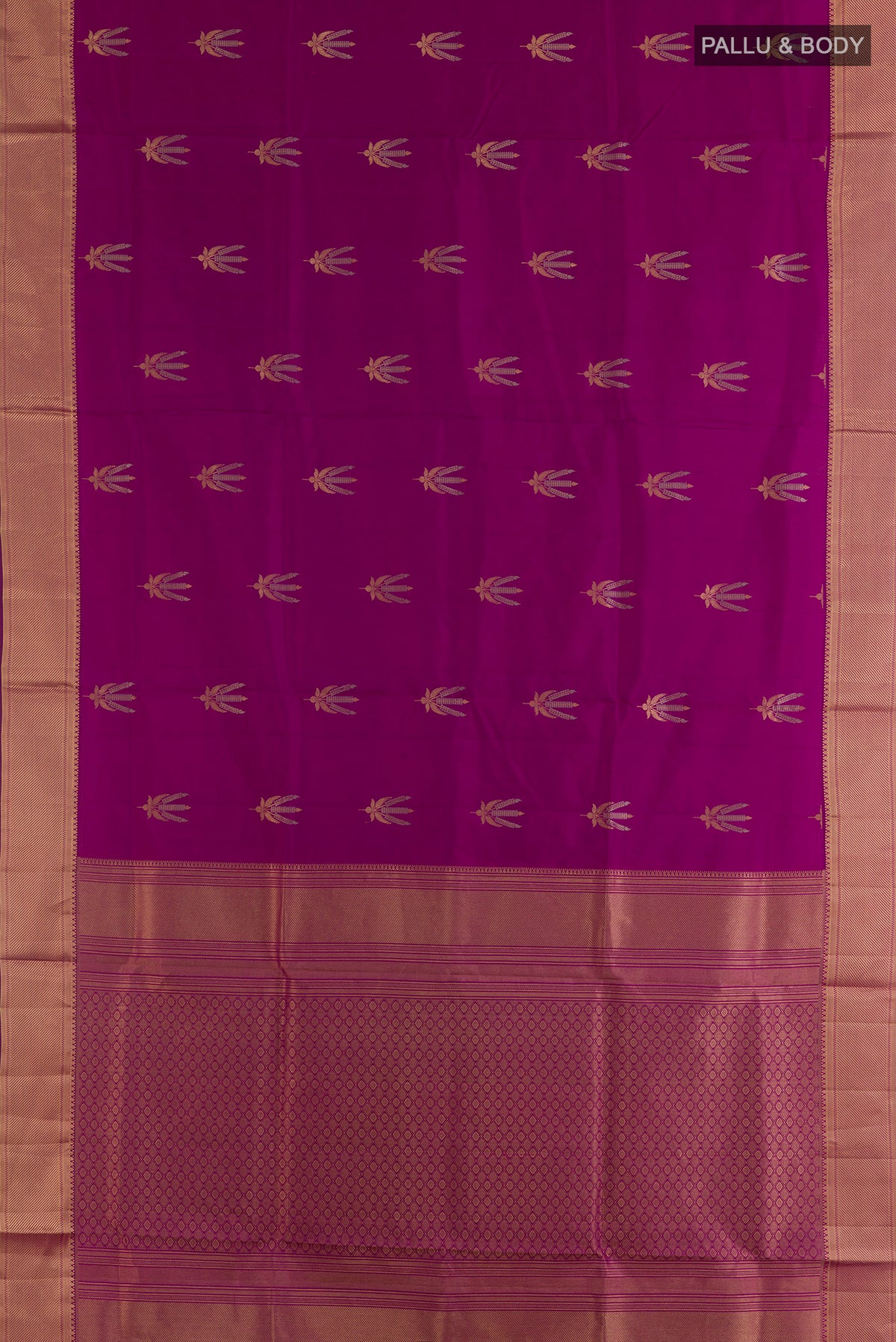 Flat view of Pure Silk Magenta Soft Saree with Zari Butta on the body and Zari Border. 