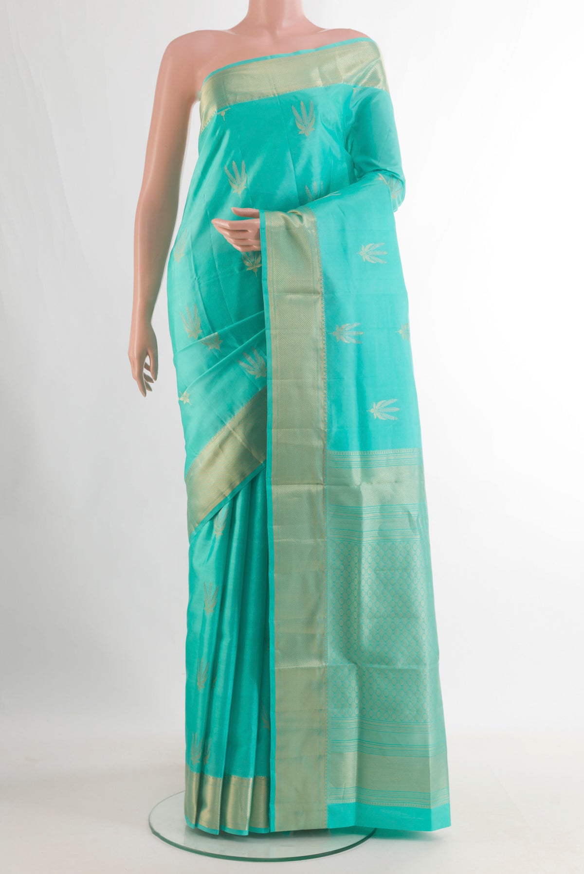 Pure Silk Sea Green Soft Saree with Zari Butta on the body and Zari Border.  displayed on a mannequin