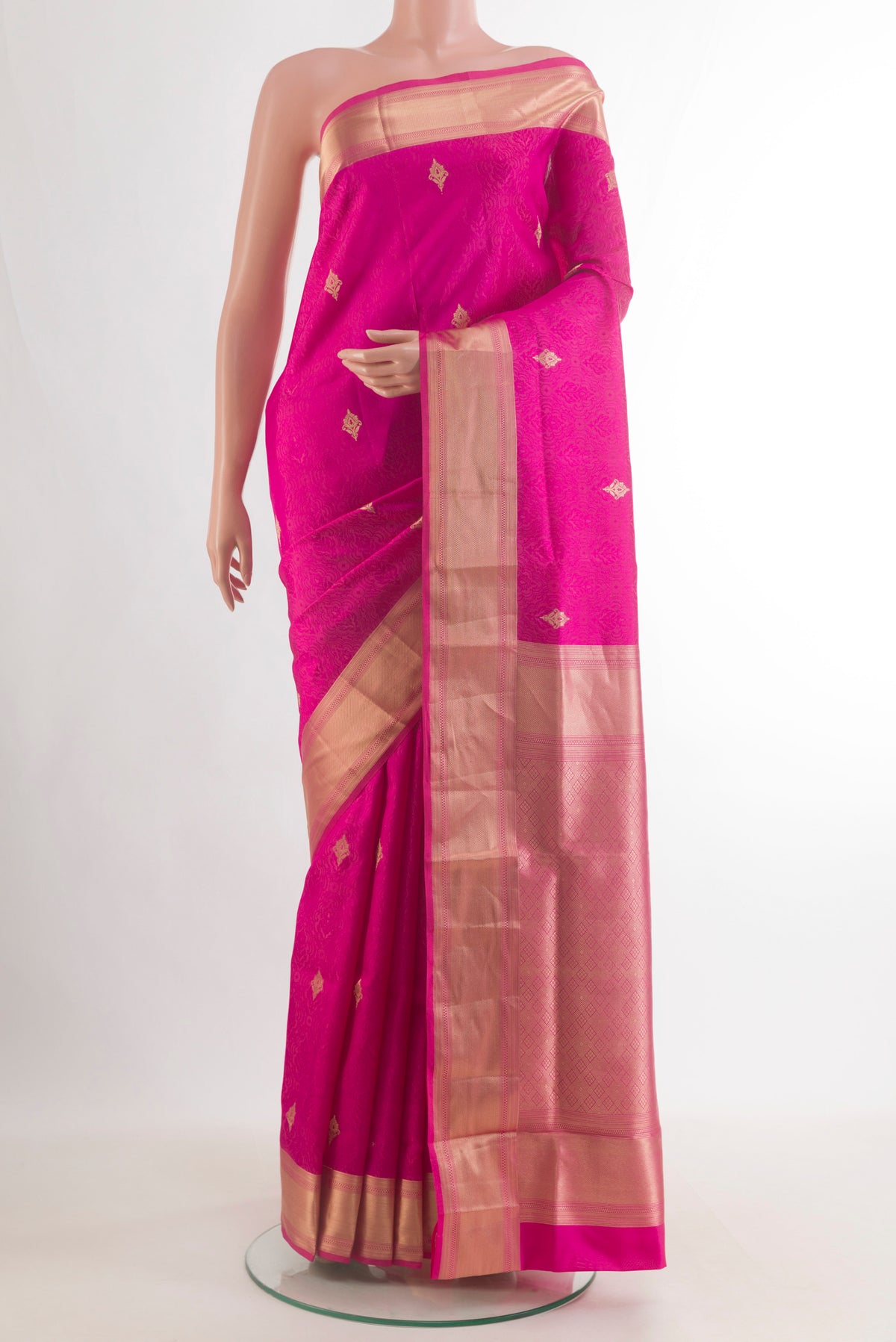 Pure Silk Pink Soft Saree with Jacquard With Zari Butta on the body and Zari Border.  displayed on a mannequin