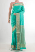 Pure Silk Sea Green Soft Saree with Jacquard With Zari Butta on the body and Zari Border.  displayed on a mannequin
