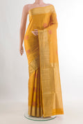 Pure Silk Mustard Soft Saree with Zari And Thread Butta on the body and Zari Border.  displayed on a mannequin