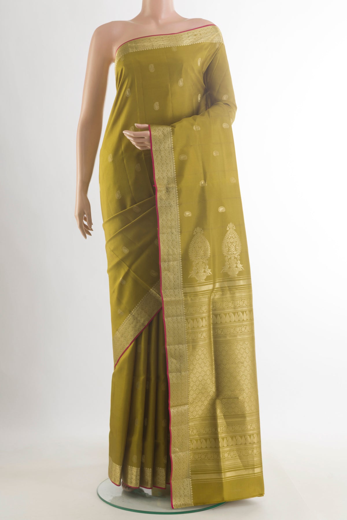 Pure Silk Mehandi Green Soft Saree with Zari Butta on the body and Zari Border.  displayed on a mannequin