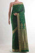 Pure Silk Green Soft Saree with Zari Butta on the body and Zari Border.  displayed on a mannequin