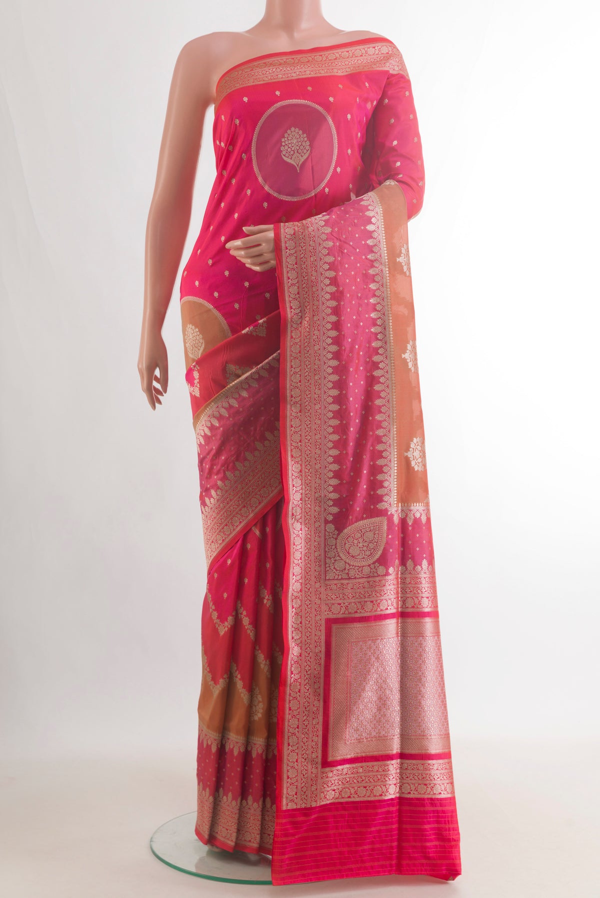 Pure Silk Pink Banarasi Saree with Zari Butta on the body and Zari Border.  displayed on a mannequin