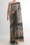 Beige Tussar Saree with Printed design on the body and Zari Border.  displayed on a mannequin