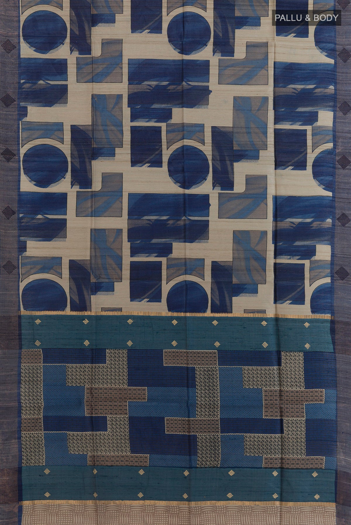 Flat view of Blue Tussar Saree with Printed design on the body and Zari Border. 