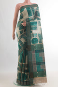 Green Tussar Saree with Printed design on the body and Zari Border.  displayed on a mannequin
