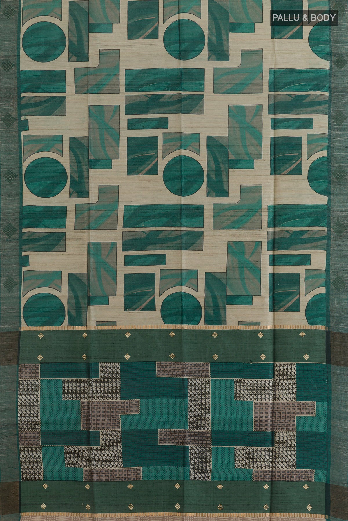 Flat view of Green Tussar Saree with Printed design on the body and Zari Border. 