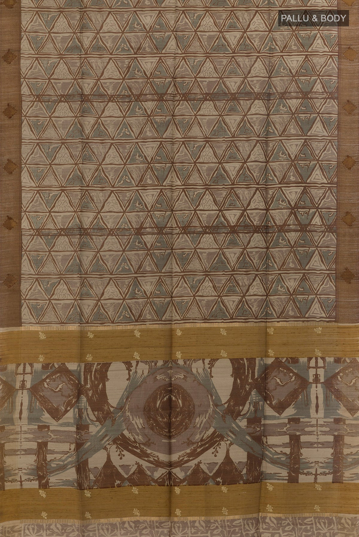 Flat view of Beige Tussar Saree with Printed design on the body and Zari Border. 