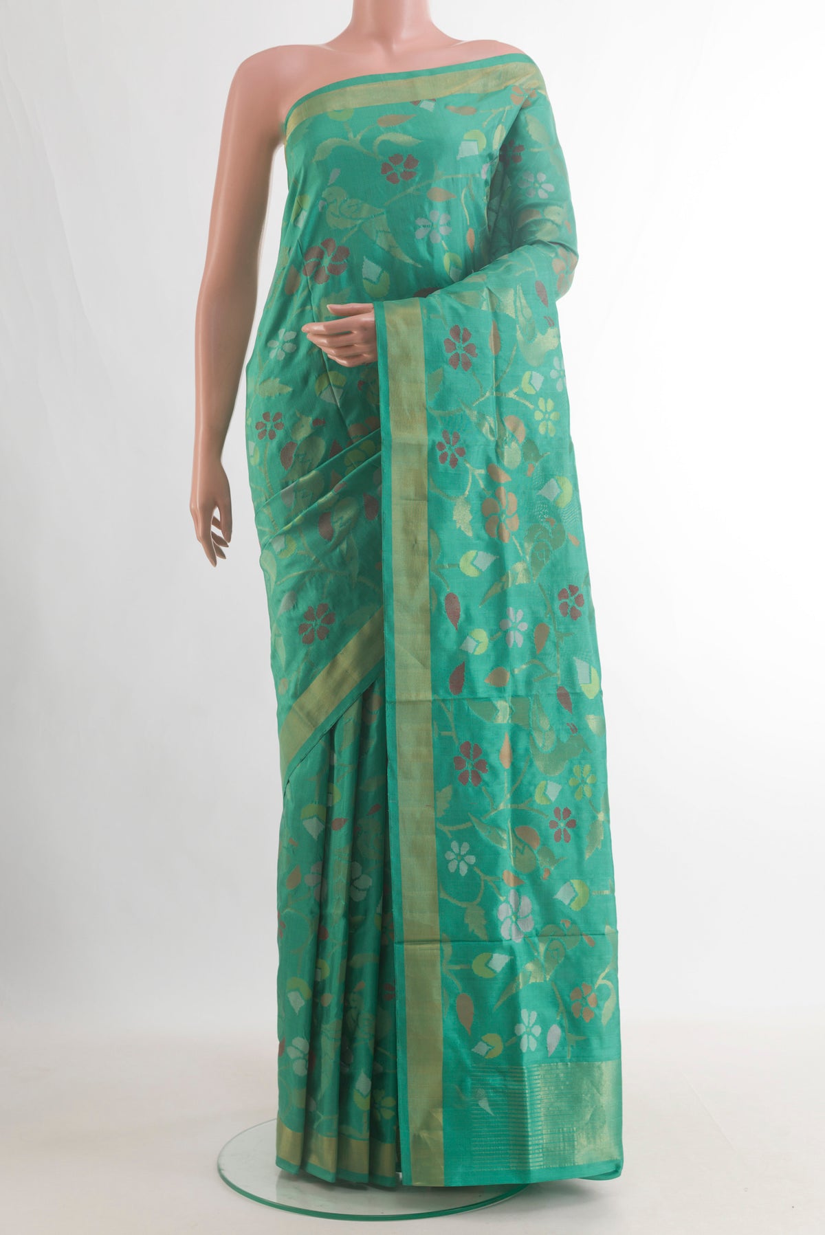 Pure Silk Green Uppada Saree with Zari Brocade on the body and Zari Border.  displayed on a mannequin