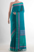 Pure Silk Peacock Blue Kanchipuram Saree with Plain Body and Thread Border.  displayed on a mannequin