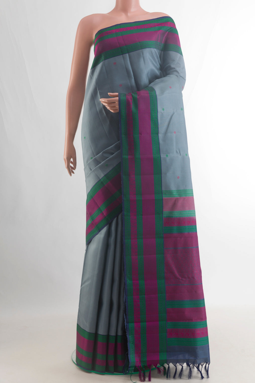 Pure Silk Grey Kanchipuram Saree with Thread Butta on the body and Thread Border.  displayed on a mannequin