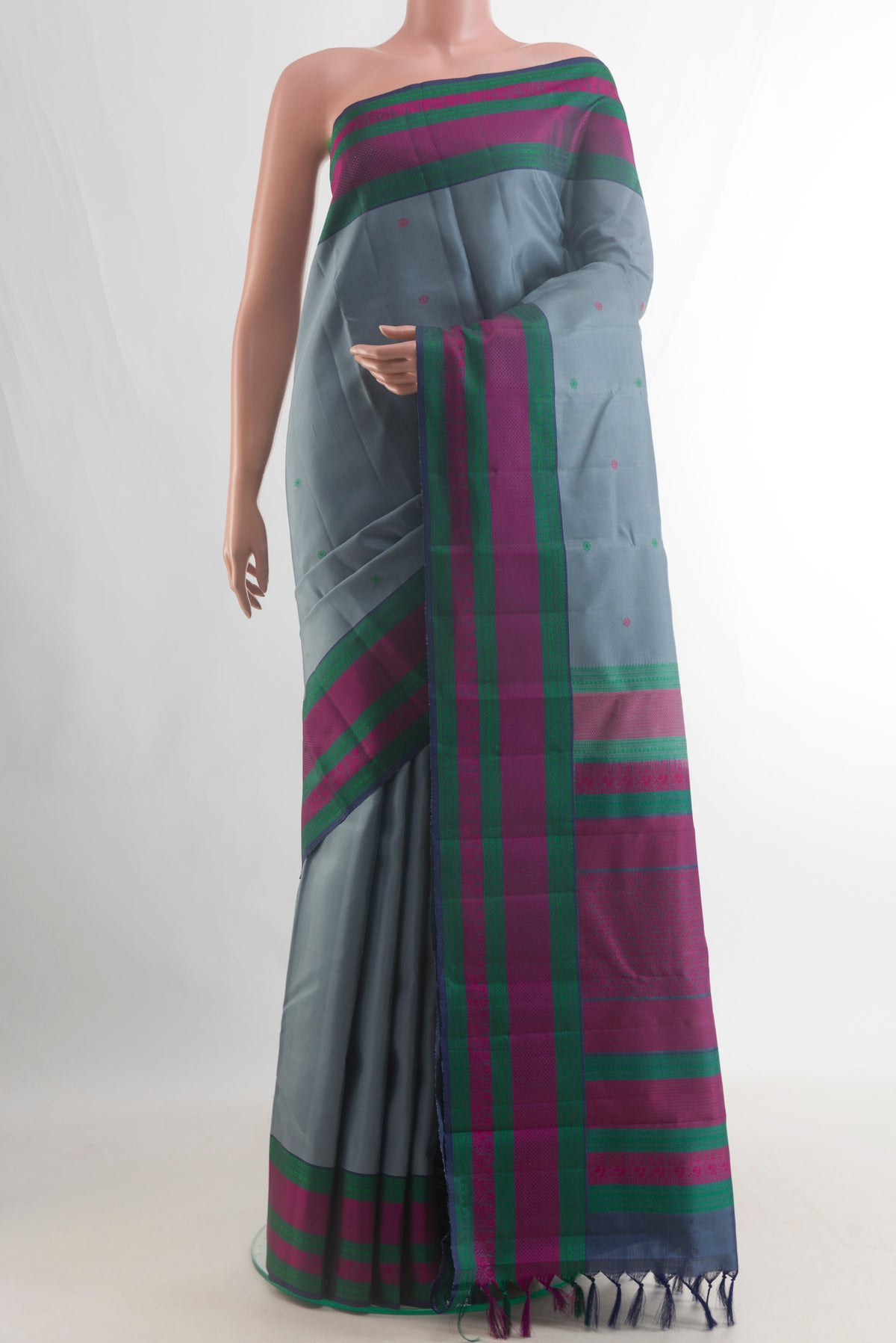 Pure Silk Grey Kanchipuram Saree with Thread Butta on the body and Thread Border.  displayed on a mannequin