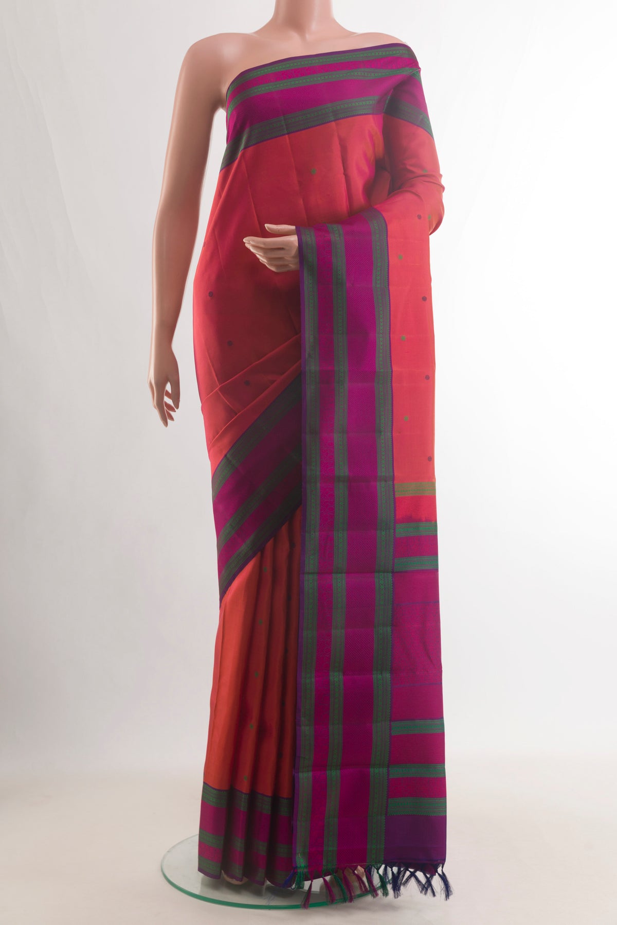 Pure Silk Red Kanchipuram Saree with Thread Butta on the body and Thread Border.  displayed on a mannequin