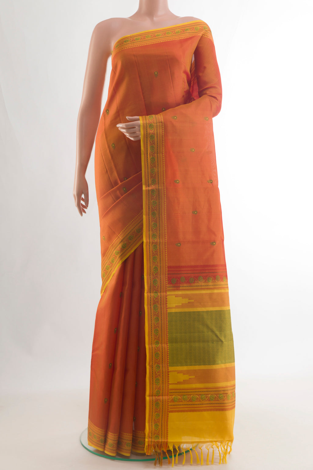 Pure Silk Orange Kanchipuram Saree with Thread Butta on the body and Thread Border.  displayed on a mannequin