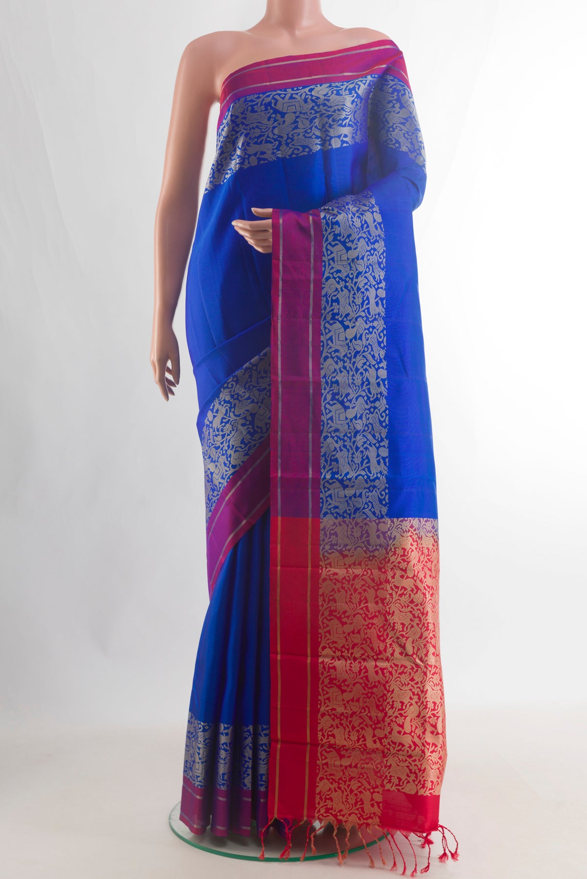 Pure Silk Royal Blue Kanchipuram Saree with Plain Body and Fancy Border.  displayed on a mannequin