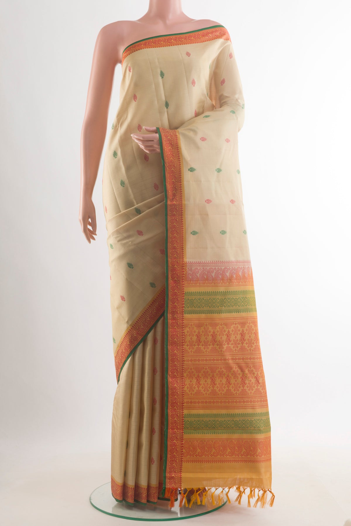 Pure Silk Cream Kanchipuram Saree with Thread Butta on the body and Thread Border.  displayed on a mannequin