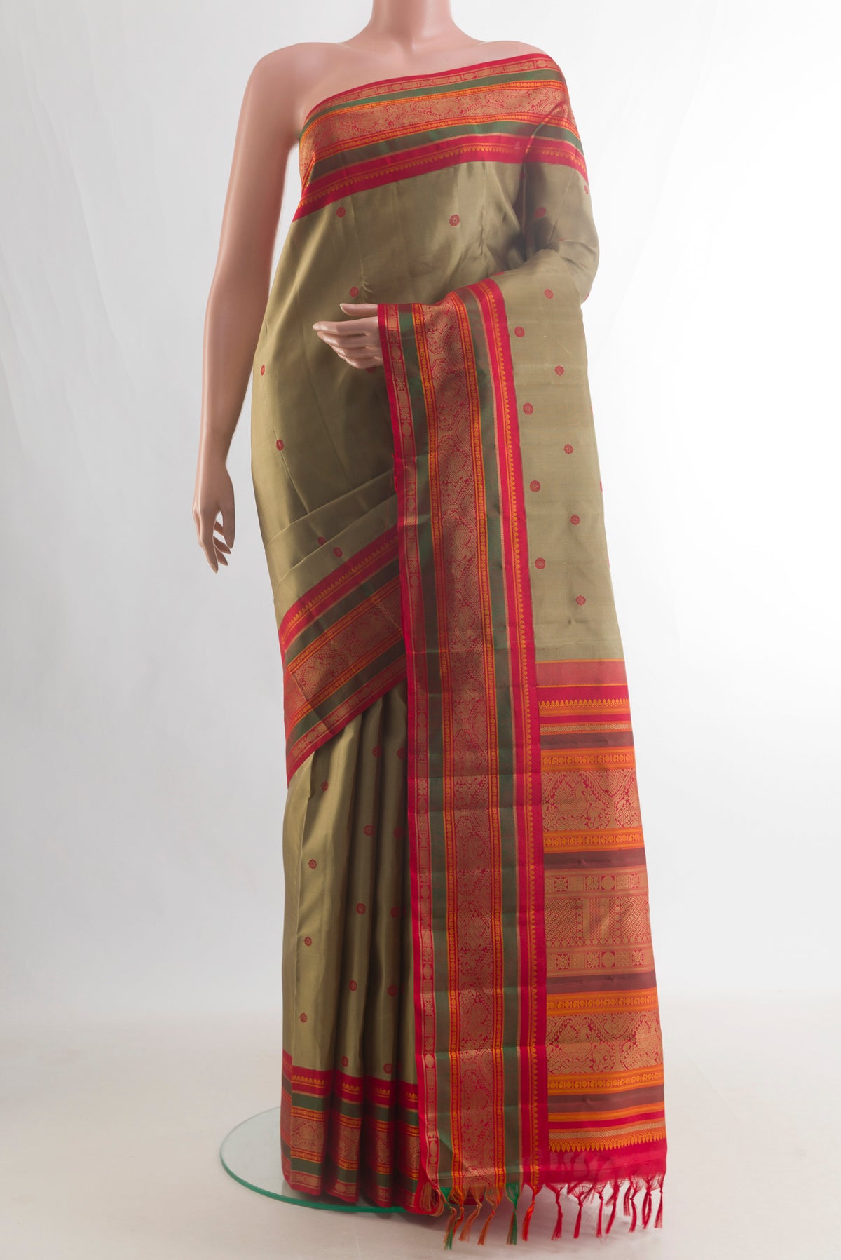Pure Silk Dark Beige Kanjivaram Saree with Thread Butta on the body and Thread Border.  displayed on a mannequin