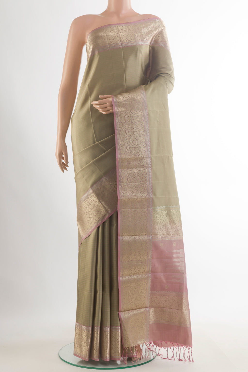 Pure Silk Dark Beige Kanchipuram Saree with Plain Body and Zari Border.  displayed on a mannequin