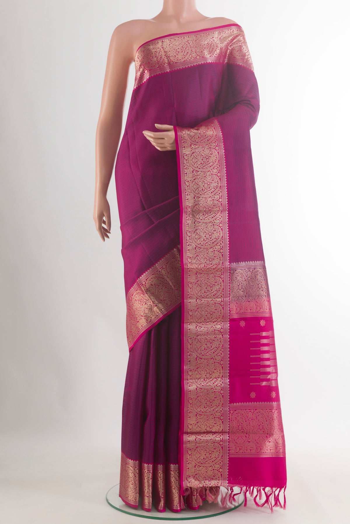 Pure Silk Purple Kanchipuram Saree with Stripes on the body and Zari Border.  displayed on a mannequin