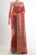 Pure Silk Brick Orange Kanchipuram Saree with Jacquard With Zari Butta on the body and Zari Border.  displayed on a mannequin
