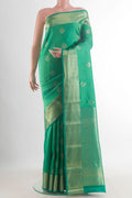 Pure Silk Green Kanchipuram Saree with Jacquard With Zari Butta on the body and Zari Border.  displayed on a mannequin