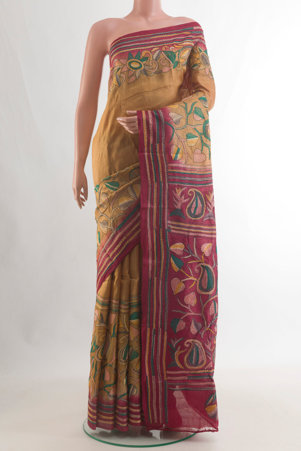 Mustard Tussar Saree with Kantha Work on the body and Embroidery Border.  displayed on a mannequin