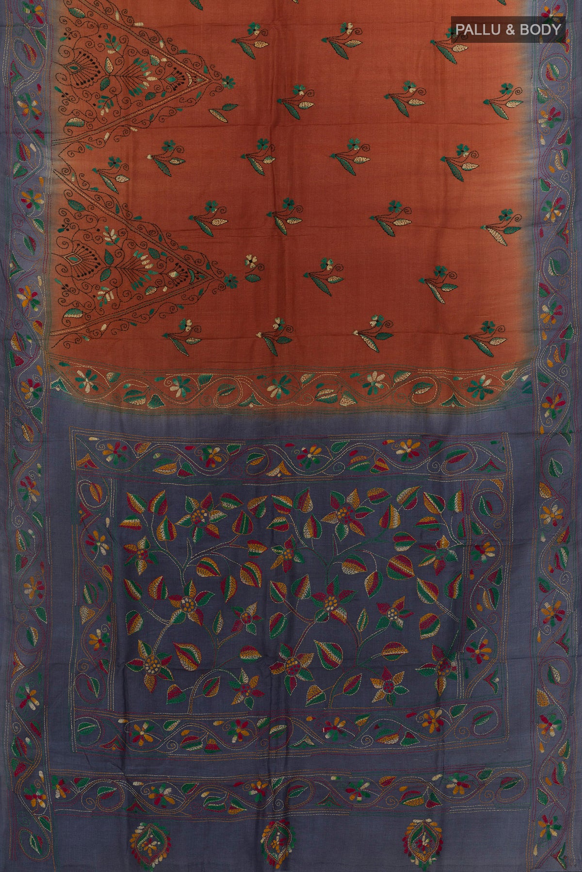 Flat view of Rust Tussar Saree with Kantha Work on the body and Embroidery Border. 