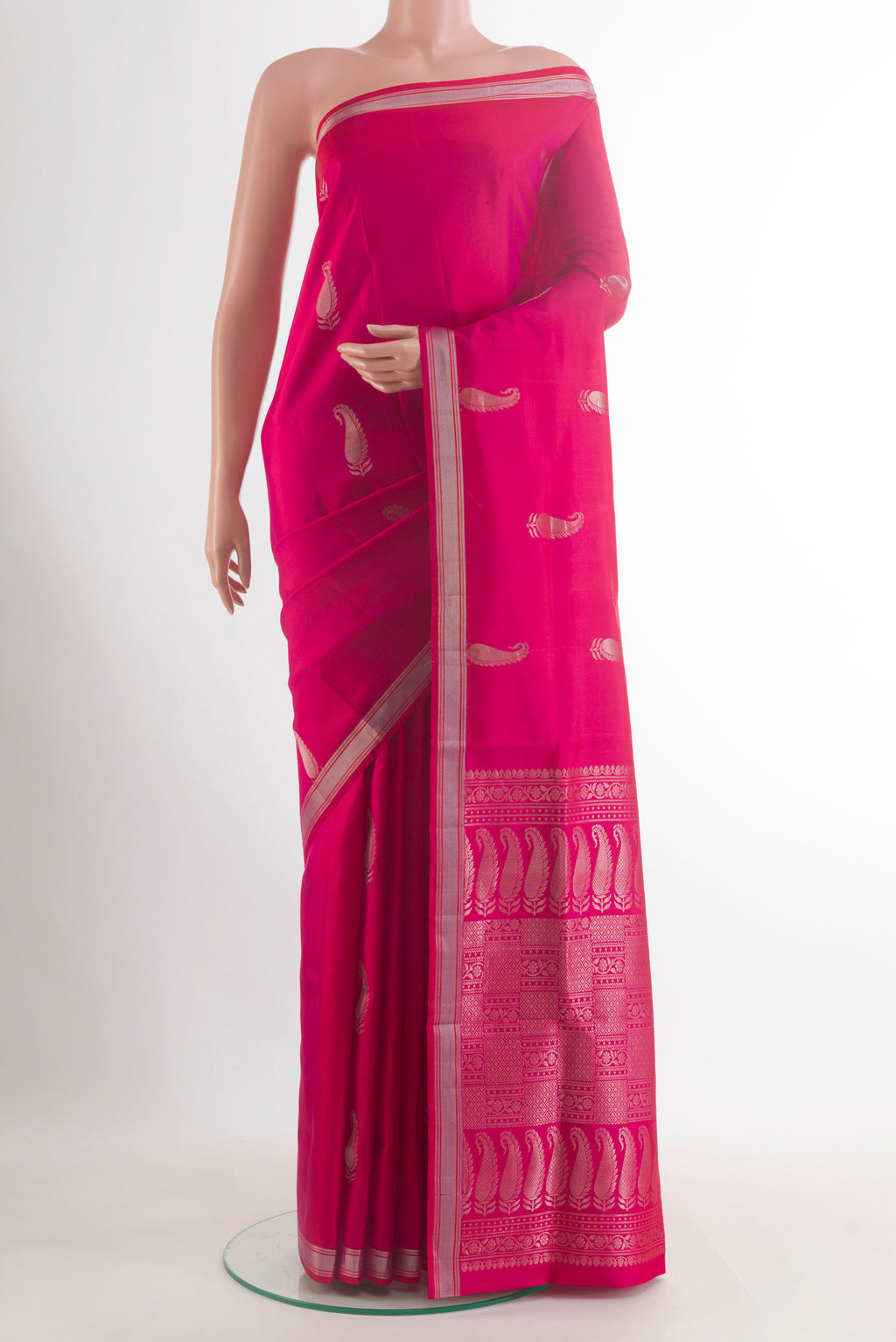 Pure Silk Pink Soft Saree with Zari Butta on the body and Zari Border.  displayed on a mannequin