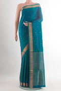 Pure Silk Peacock Blue Soft Saree with Zari Butta on the body and Zari Border.  displayed on a mannequin
