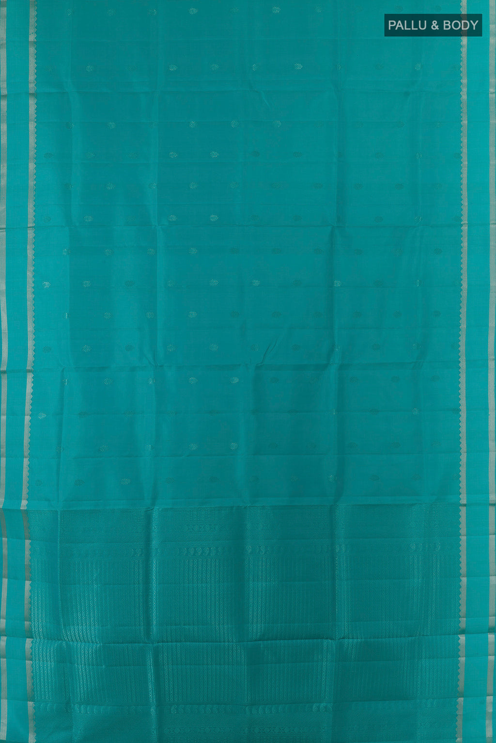 Flat view of Pure Silk Turquoise Soft Saree with Zari Butta on the body and Zari Border. 