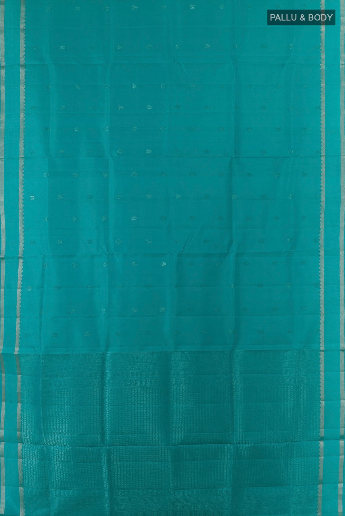 Flat view of Pure Silk Turquoise Soft Saree with Zari Butta on the body and Zari Border. 