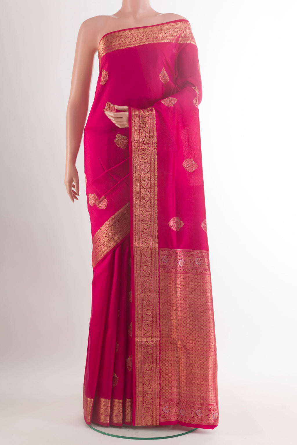 Pure Silk Pink Soft Saree with Zari Butta on the body and Zari Border.  displayed on a mannequin