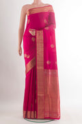 Pure Silk Pink Soft Saree with Zari Butta on the body and Zari Border.  displayed on a mannequin