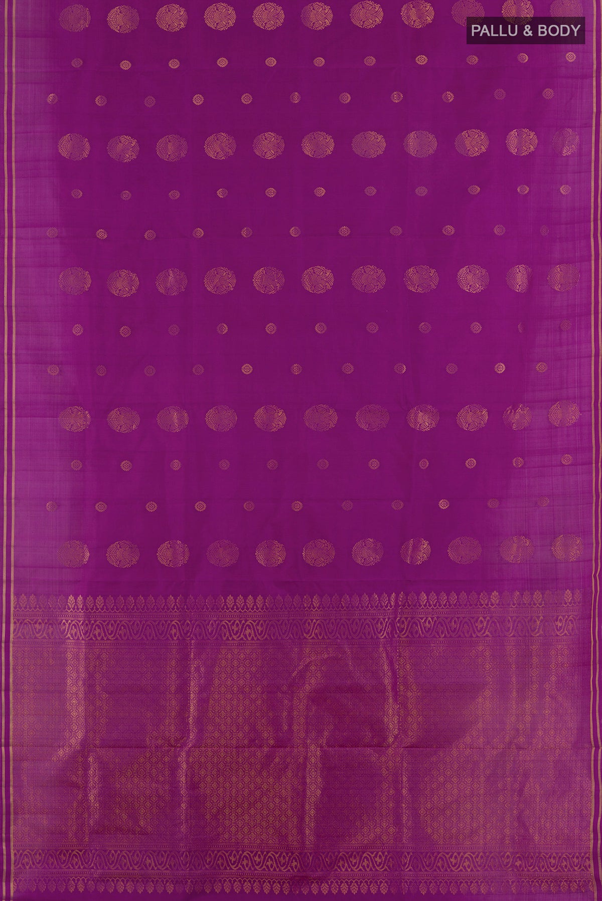Flat view of Pure Silk Purple Soft Saree with Zari Butta on the body and Zari Border. 