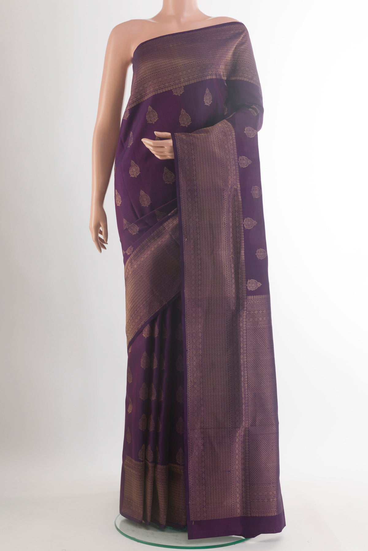 Pure Silk Purple Soft Saree with Zari Butta on the body and Zari Border.  displayed on a mannequin