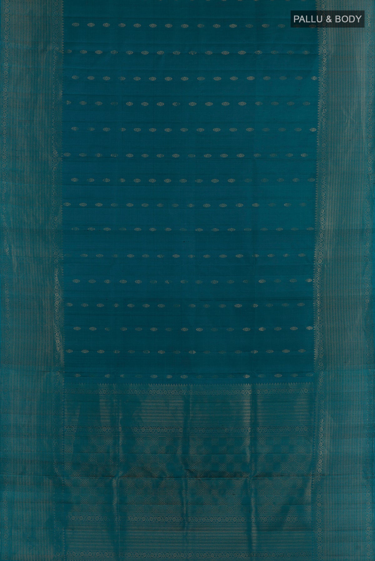 Flat view of Pure Silk Peacock Blue Soft Saree with Zari Butta on the body and Zari Border. 