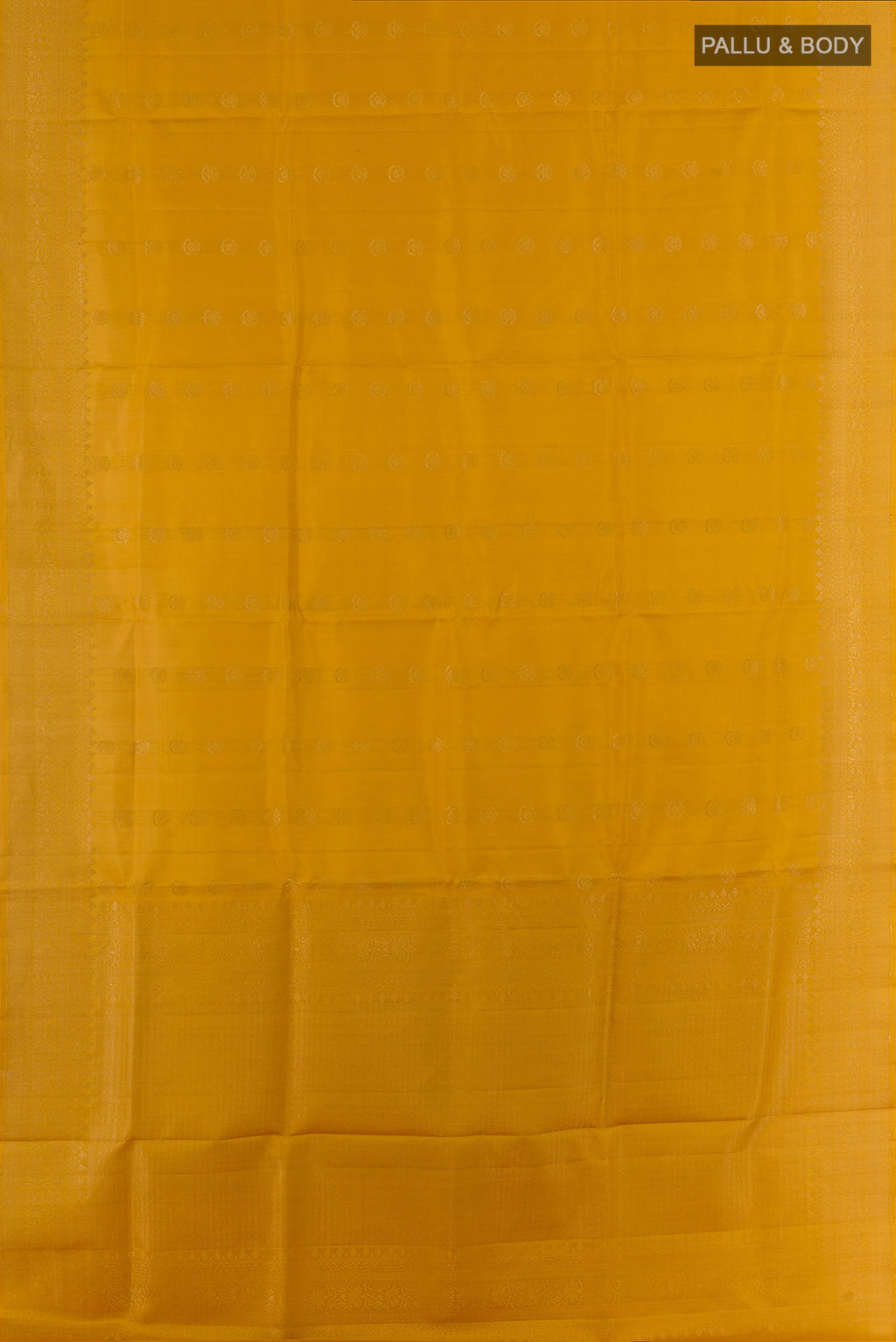 Flat view of Pure Silk Mustard Soft Saree with Zari Butta on the body and Zari Border. 