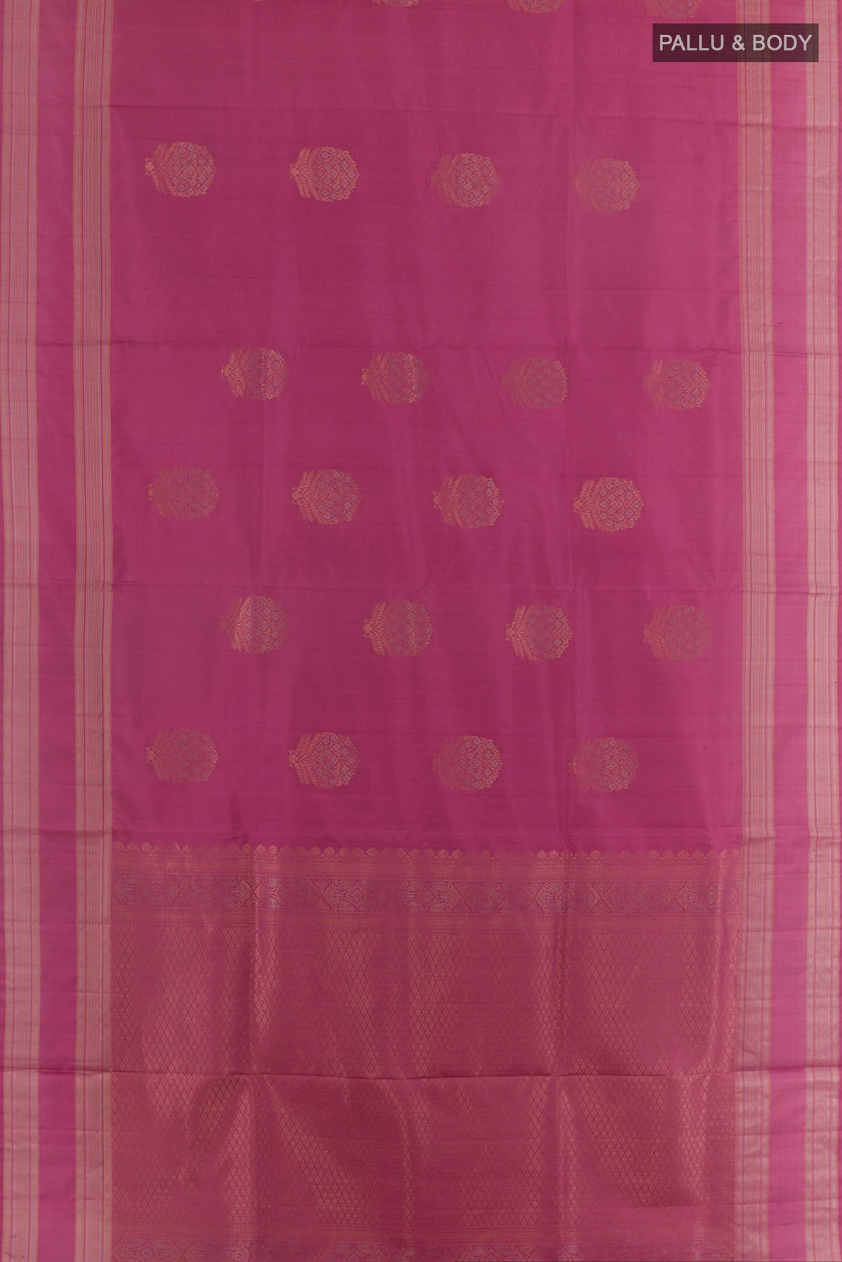 Flat view of Pure Silk Pink Soft Saree with Zari Butta on the body and Zari Border. 