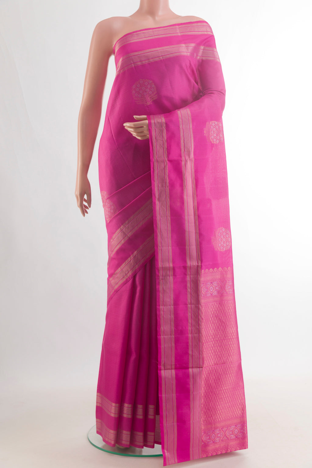 Pure Silk Pink Soft Saree with Zari Butta on the body and Zari Border.  displayed on a mannequin