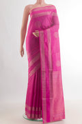Pure Silk Pink Soft Saree with Zari Butta on the body and Zari Border.  displayed on a mannequin