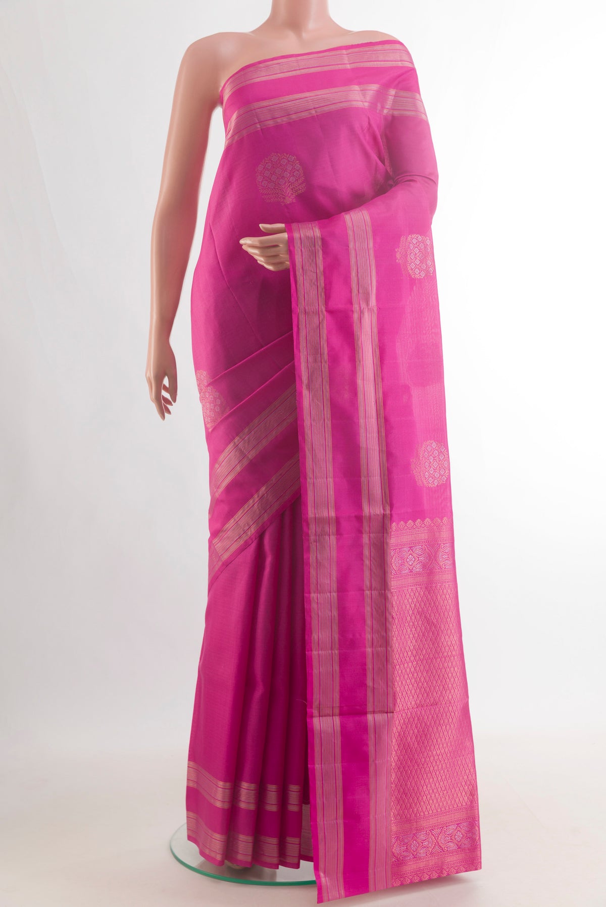 Pure Silk Pink Soft Saree with Zari Butta on the body and Zari Border.  displayed on a mannequin