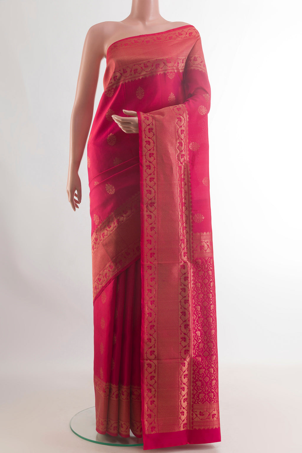 Pure Silk Dark Pink Soft Saree with Zari Butta on the body and Zari Border.  displayed on a mannequin