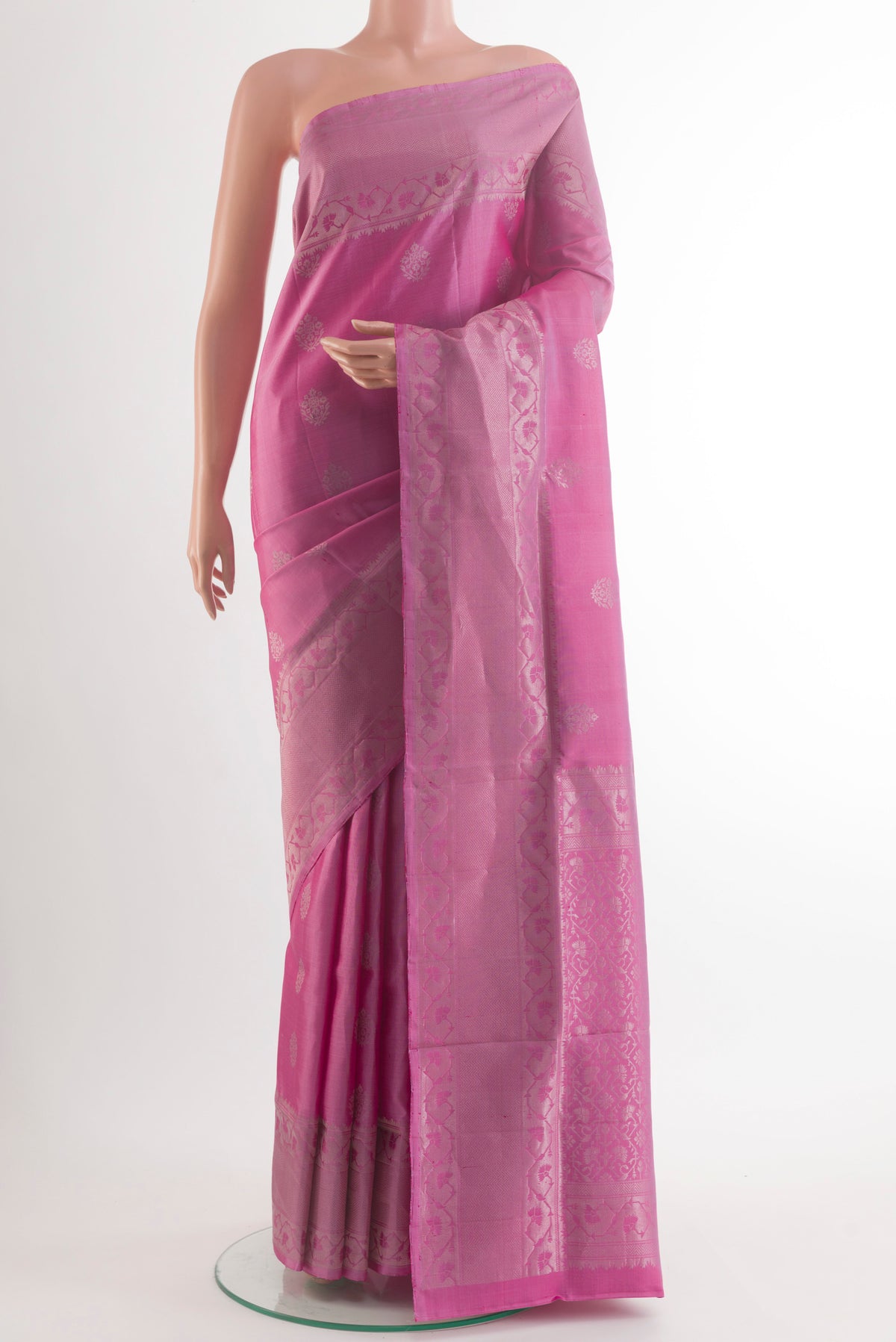 Pure Silk Pink Soft Saree with Zari Butta on the body and Zari Border.  displayed on a mannequin