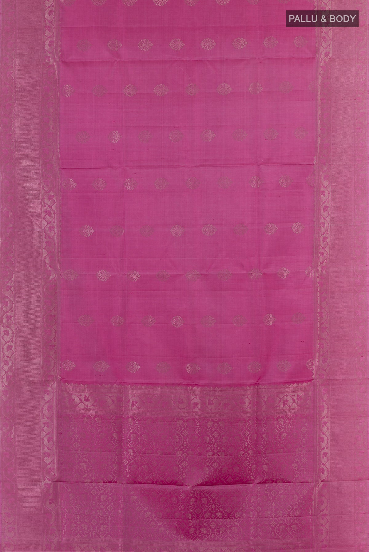Flat view of Pure Silk Pink Soft Saree with Zari Butta on the body and Zari Border. 