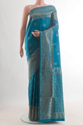 Pure Silk Blue Soft Saree with Zari Butta on the body and Zari Border.  displayed on a mannequin