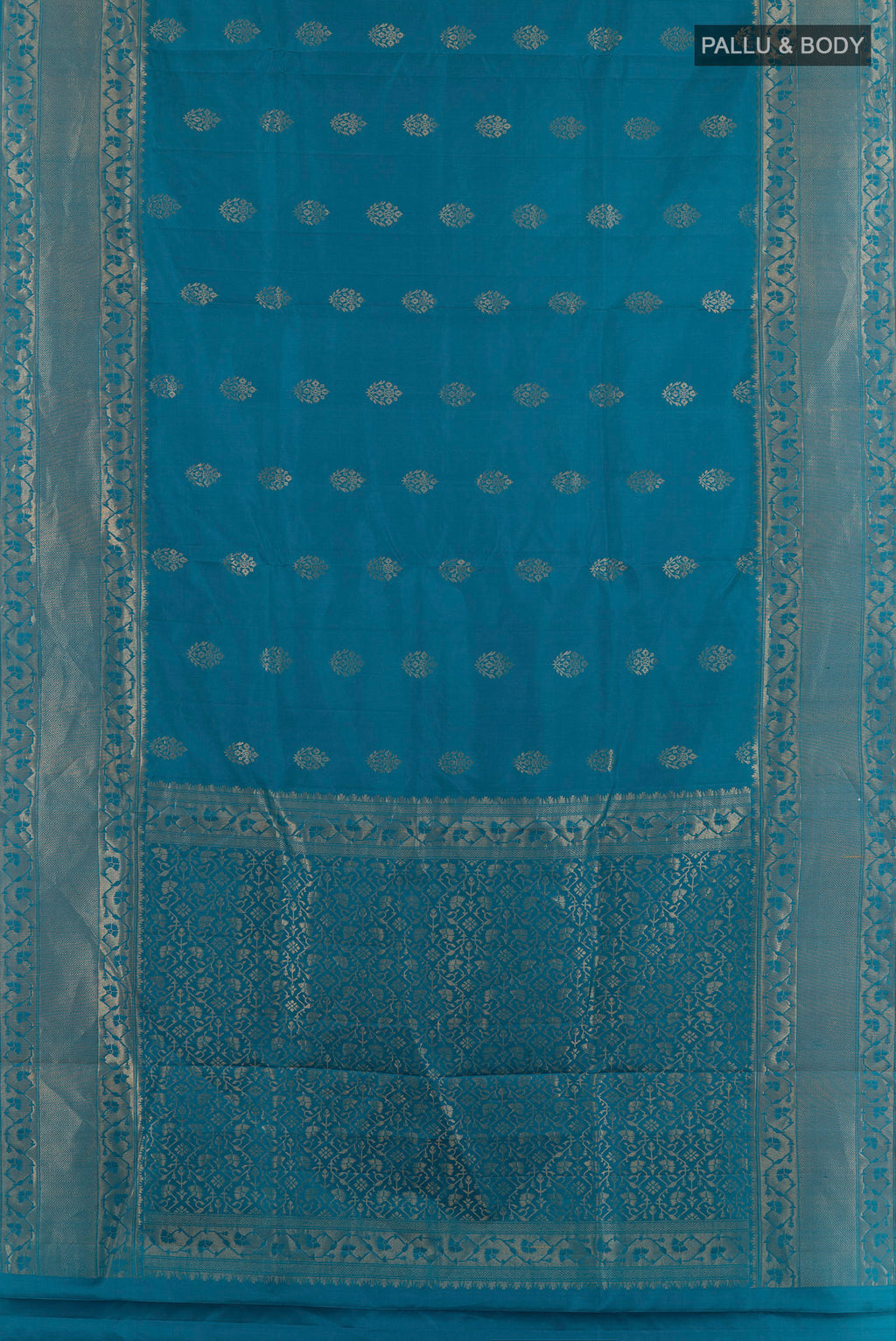 Flat view of Pure Silk Blue Soft Saree with Zari Butta on the body and Zari Border. 
