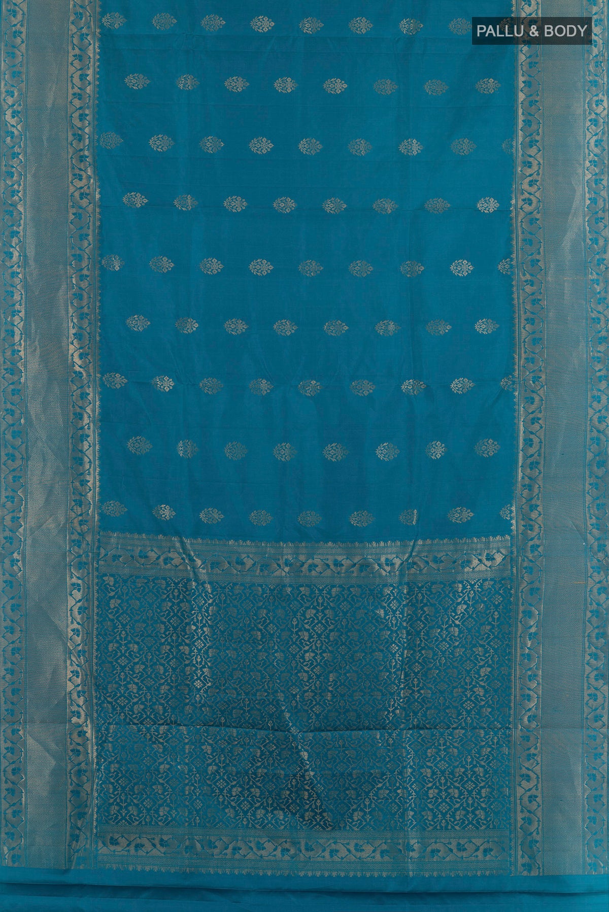 Flat view of Pure Silk Blue Soft Saree with Zari Butta on the body and Zari Border. 