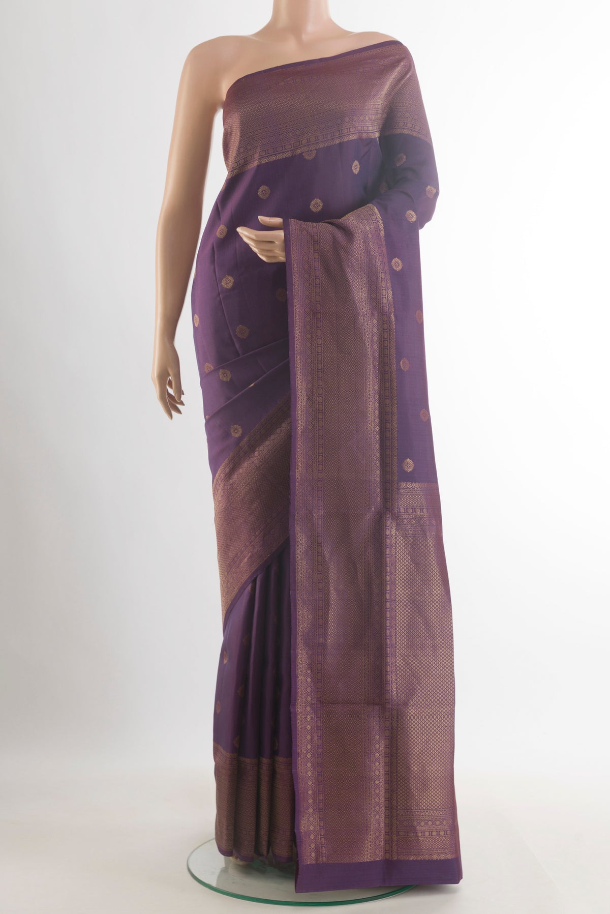 Pure Silk Purple Soft Saree with Zari Butta on the body and Zari Border.  displayed on a mannequin